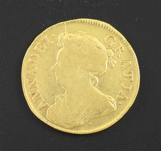 A Queen Anne gold guinea 1714, obv. scratch to bust otherwise F, rev. NVF